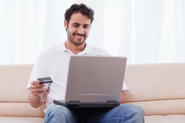 Man buying online in his living room-1